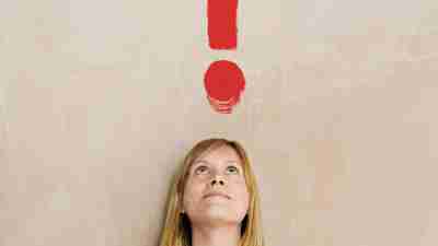 ADHD test. A woman in a green shirt stares up at an imaginary red question mark and wonders, 'Do I have adhd?' She takes the ADD test for adults.