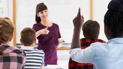 Teacher interacting with students in the classroom